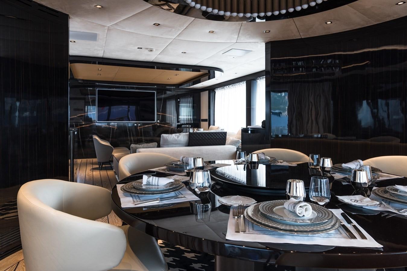 a large room with a table and chairs aboard DYNAMIQ GTT 115  Yacht for Sale