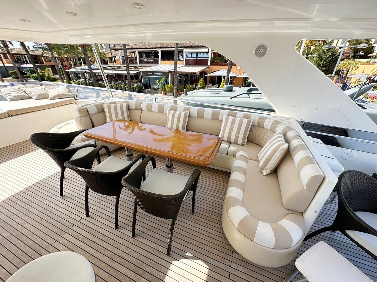 a room with tables and chairs aboard ESPRESSO Yacht for Sale