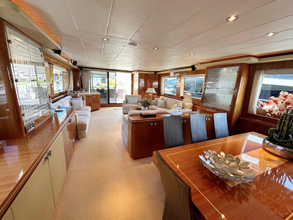 a large room with a table and chairs aboard ESPRESSO Yacht for Sale