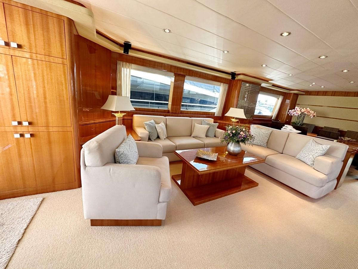 a living room with a couch and a coffee table aboard ESPRESSO Yacht for Sale