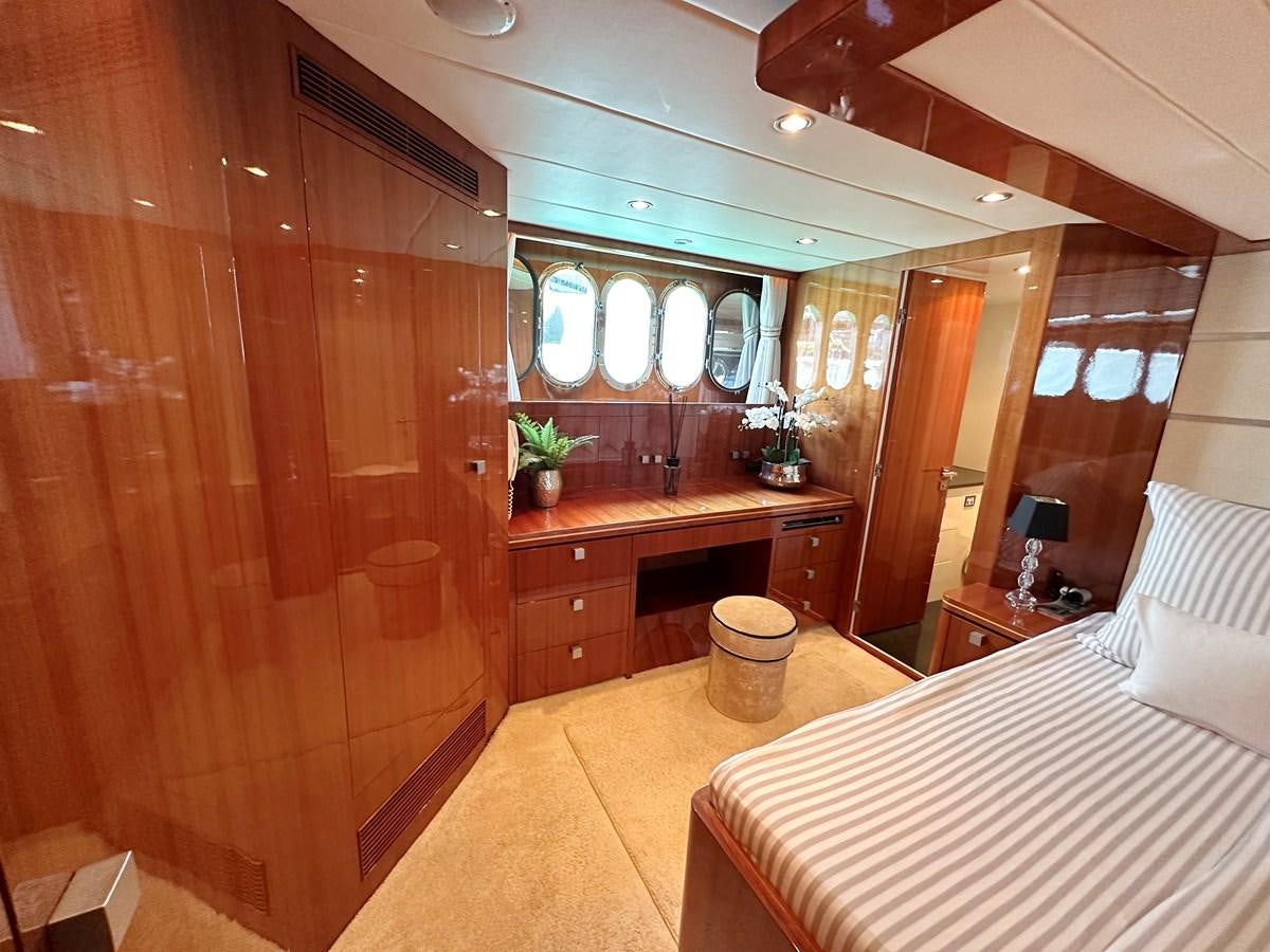 a room with a bed and a desk aboard ESPRESSO Yacht for Sale