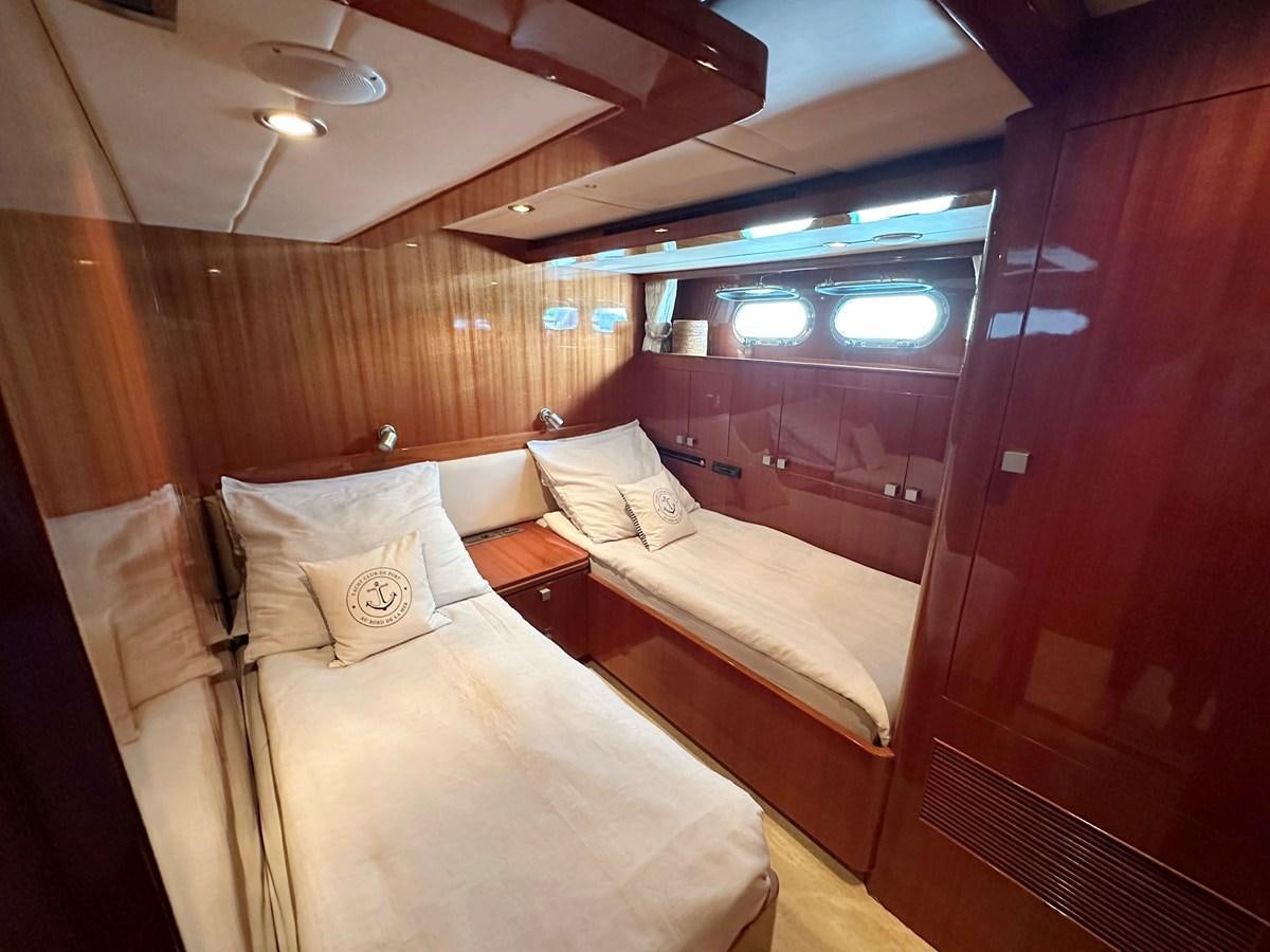 a room with a bed and a mirror aboard ESPRESSO Yacht for Sale