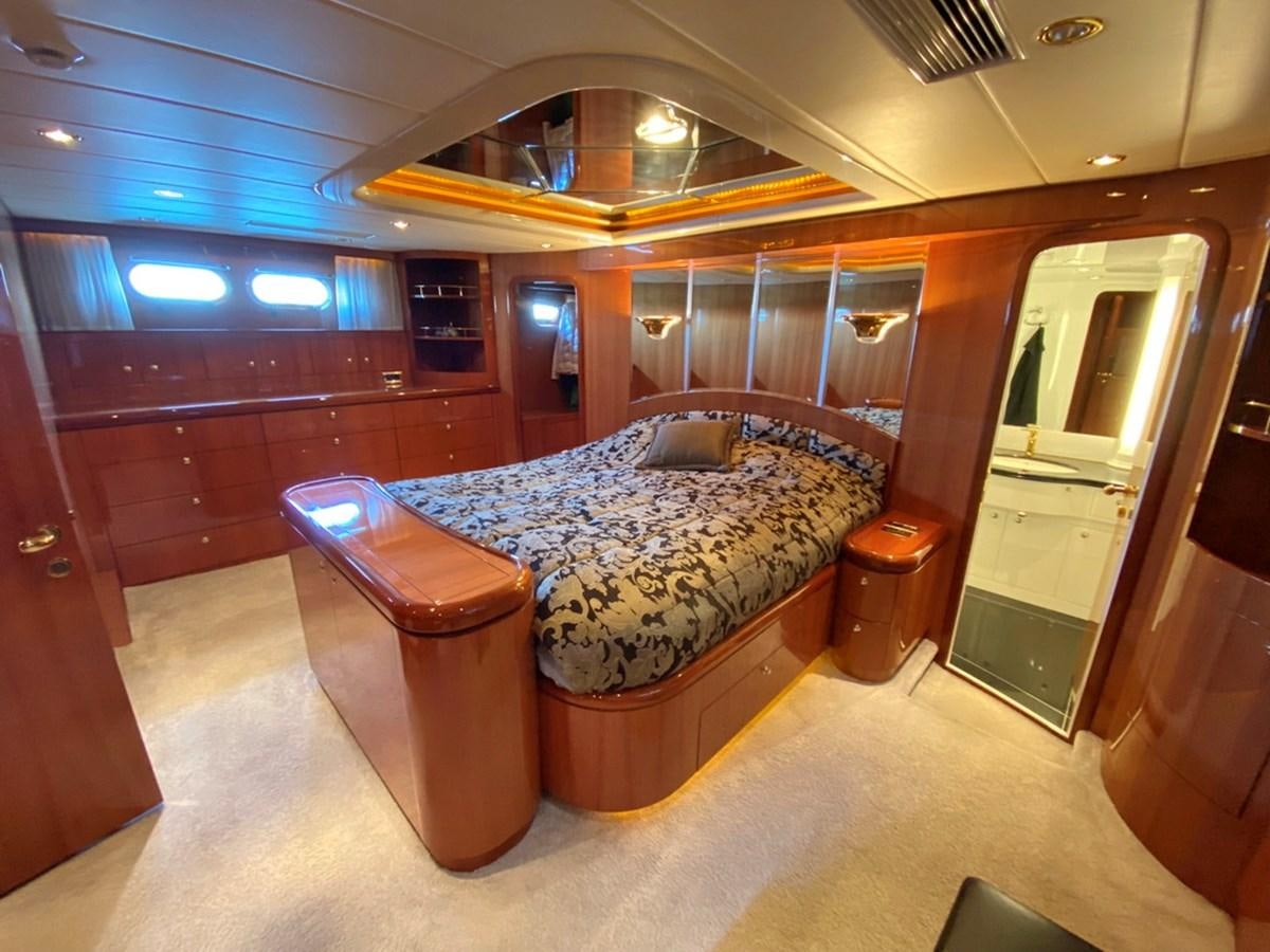 a bedroom with a bed aboard MARACAIBO Yacht for Sale
