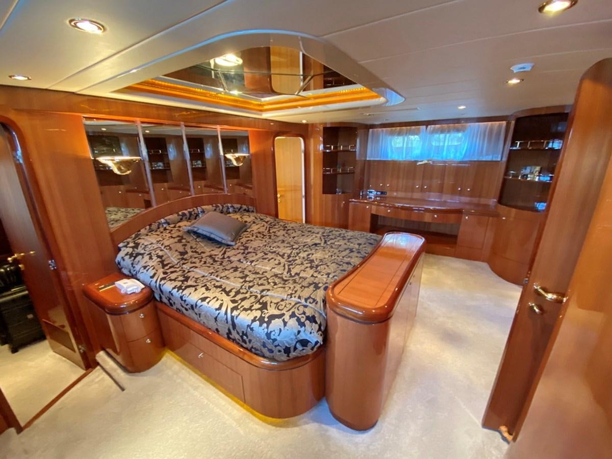 a room with a bed and a table aboard MARACAIBO Yacht for Sale