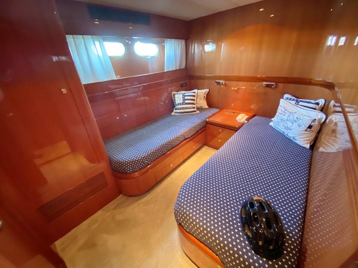 a bedroom with a bed and a mirror aboard MARACAIBO Yacht for Sale