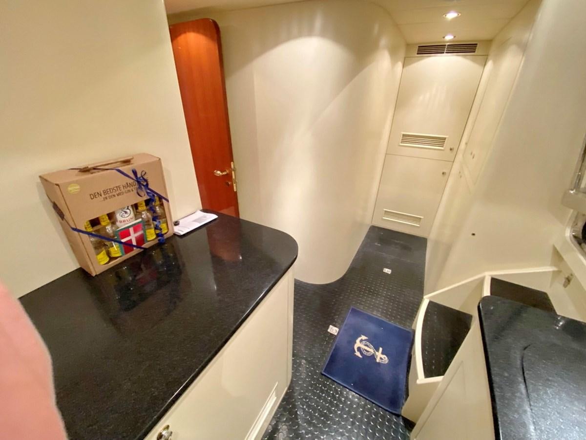 a room with a table and a box on the floor aboard MARACAIBO Yacht for Sale