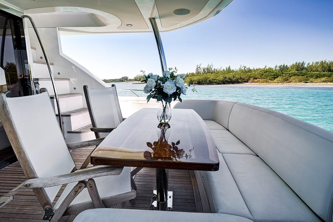 a table with chairs on it aboard MISTY K Yacht for Sale