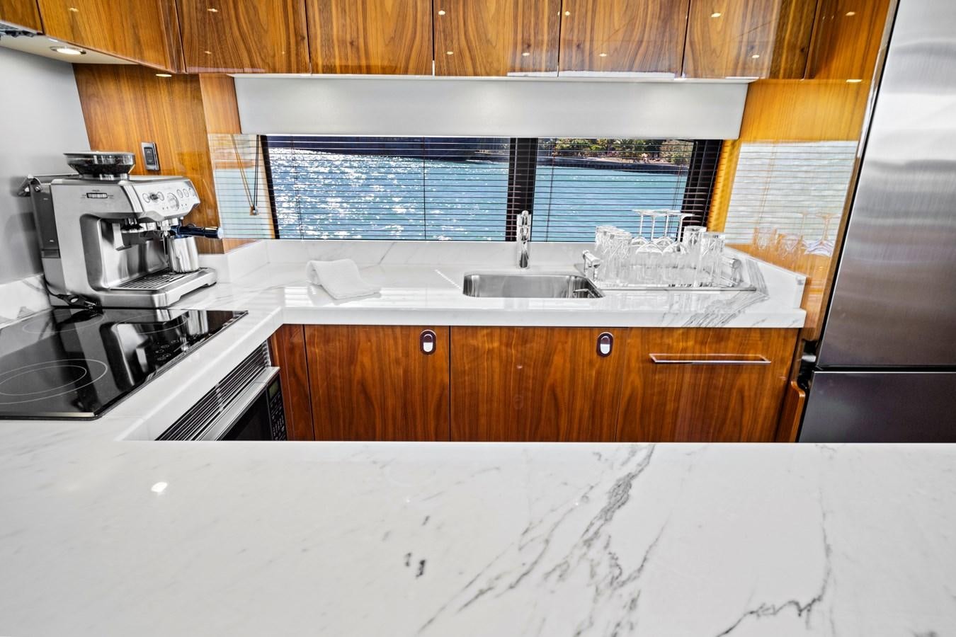 a kitchen with a sink and a microwave aboard MISTY K Yacht for Sale