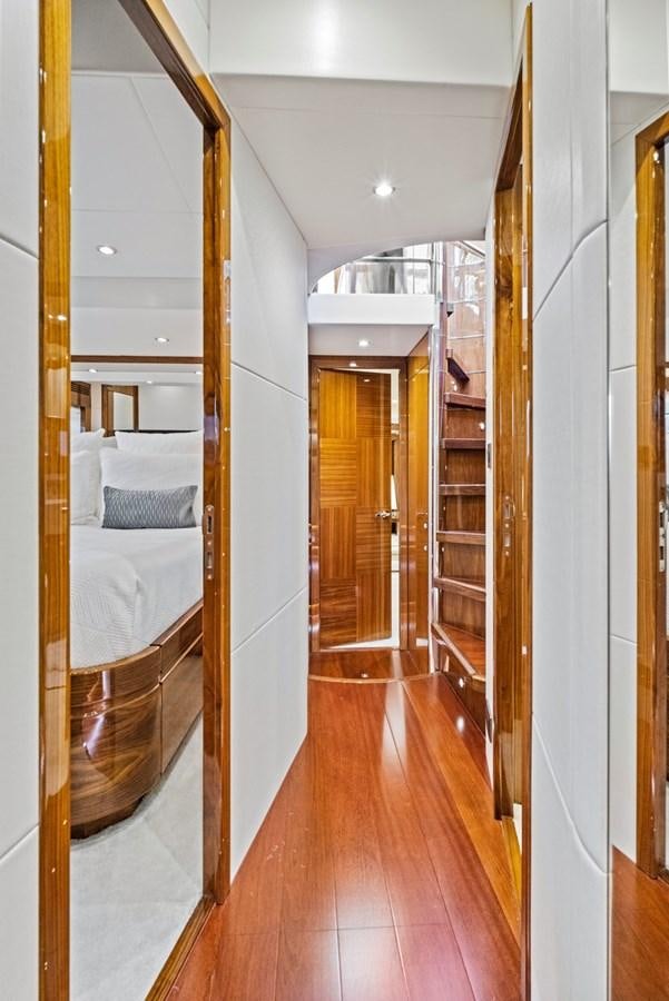 a room with a wood floor and a mirror aboard MISTY K Yacht for Sale
