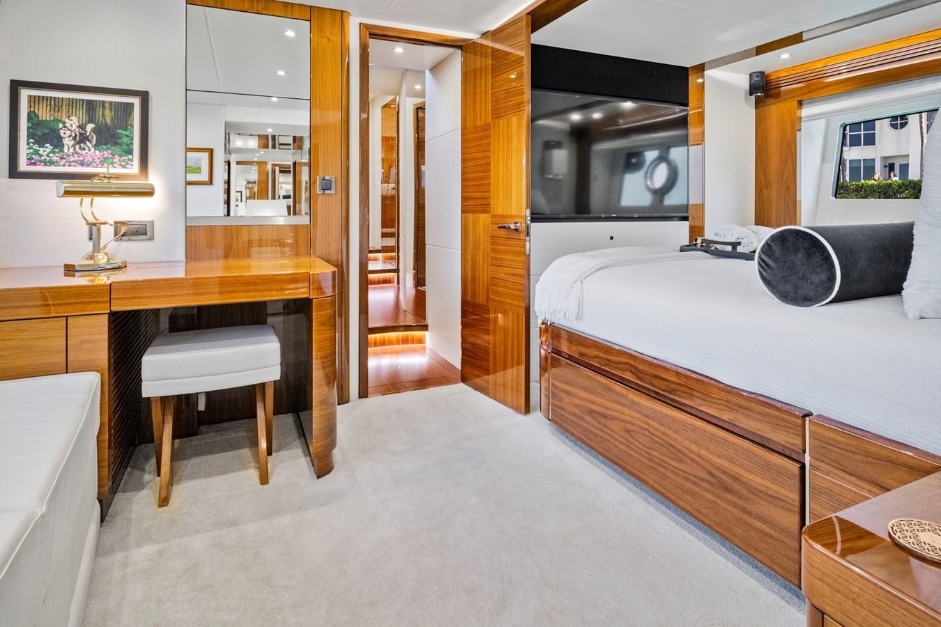 a room with a bed and desk aboard MISTY K Yacht for Sale