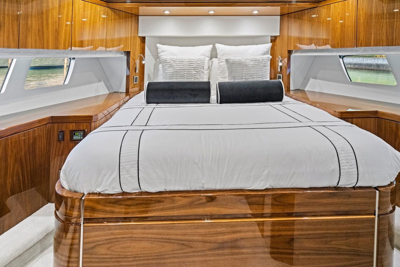 a bed with a white sheet aboard MISTY K Yacht for Sale