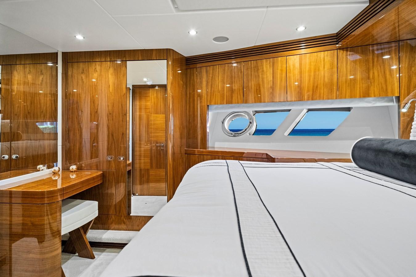a room with a bed and a desk aboard MISTY K Yacht for Sale