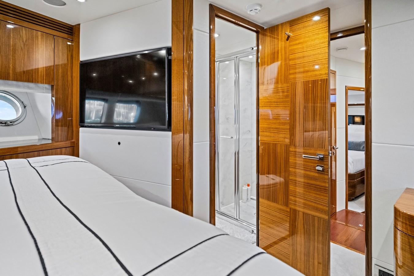 a room with a bed and a closet aboard MISTY K Yacht for Sale