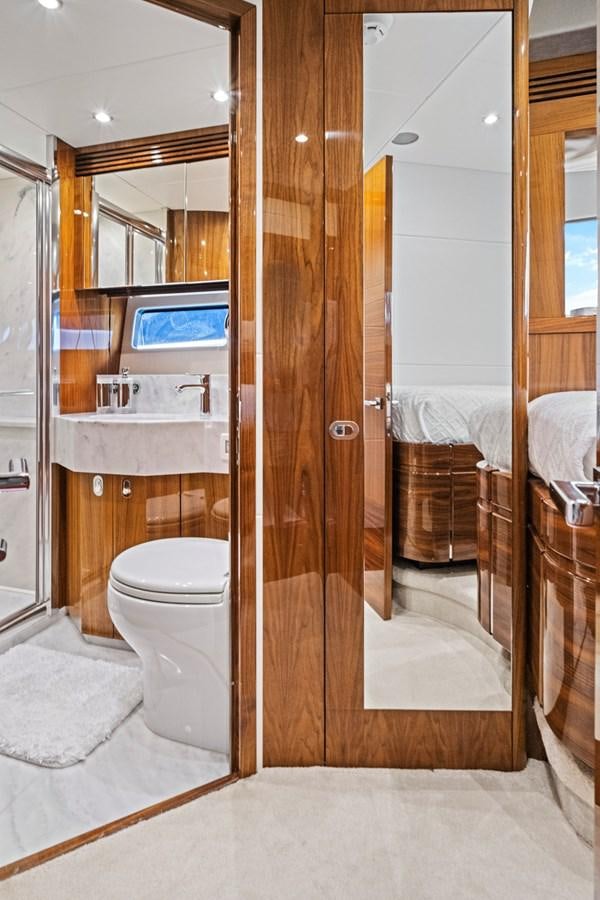 a bathroom with a toilet and a sink aboard MISTY K Yacht for Sale