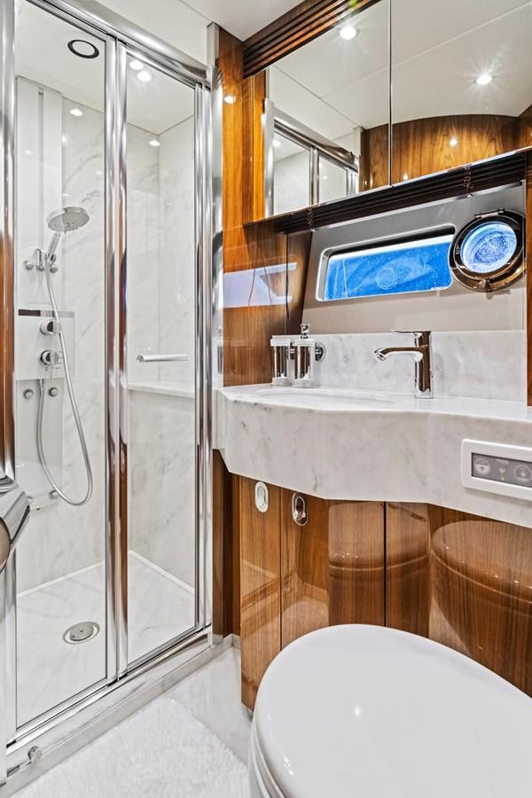 a bathroom with a glass shower aboard MISTY K Yacht for Sale