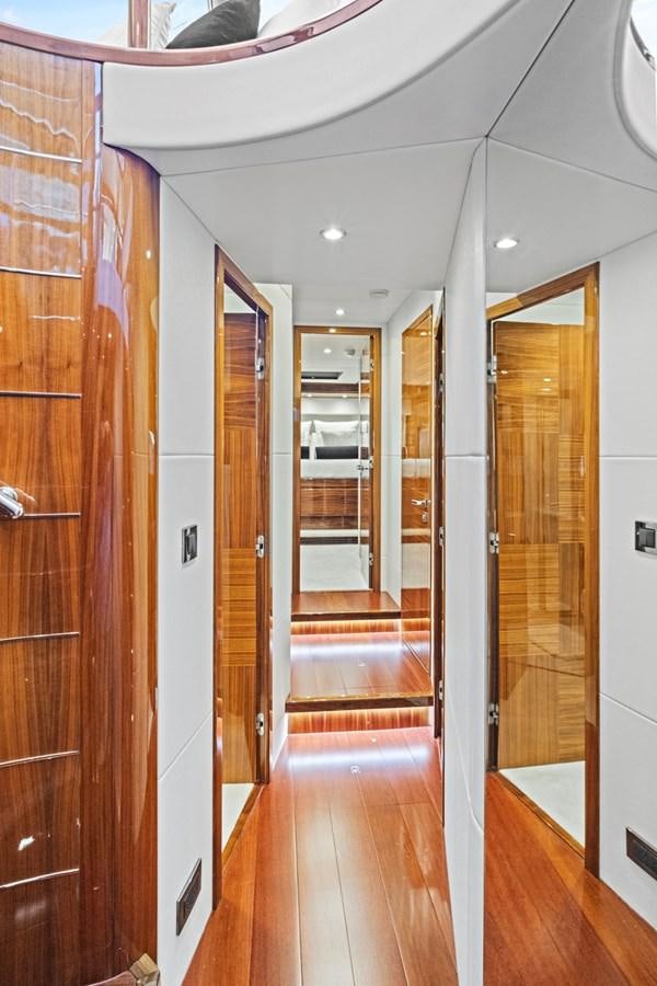 a hallway with wood doors aboard MISTY K Yacht for Sale