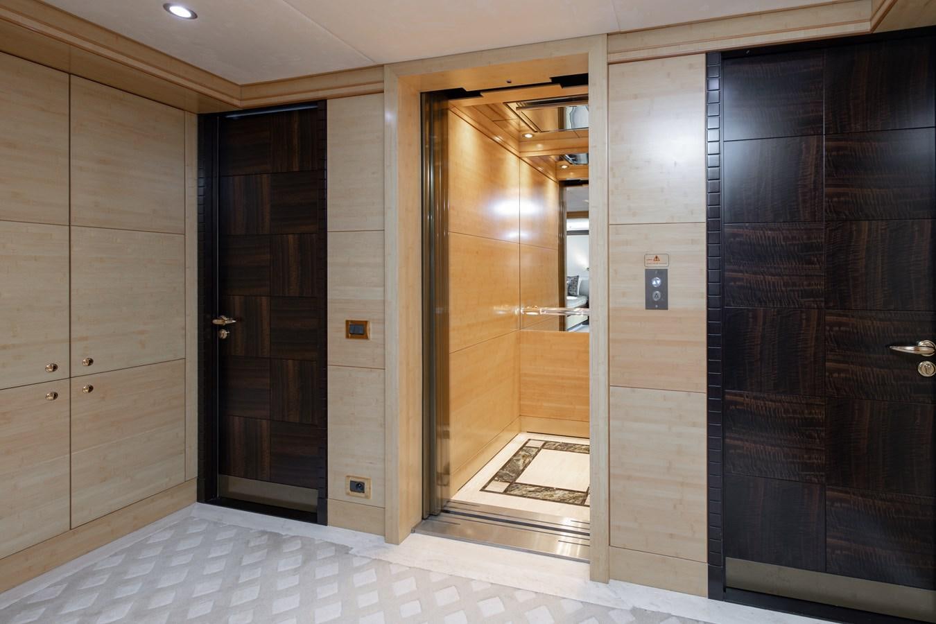 a room with wooden doors aboard LADY TAHITI Yacht for Sale