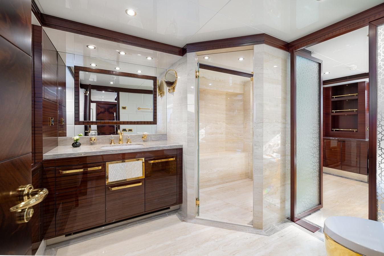 a bathroom with a large mirror aboard LADY TAHITI Yacht for Sale