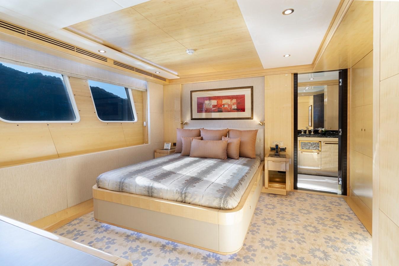 a bed in a room aboard LADY TAHITI Yacht for Sale