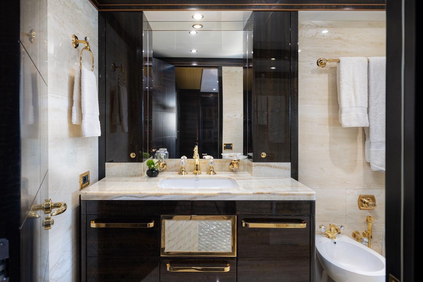 a bathroom with a large mirror aboard LADY TAHITI Yacht for Sale