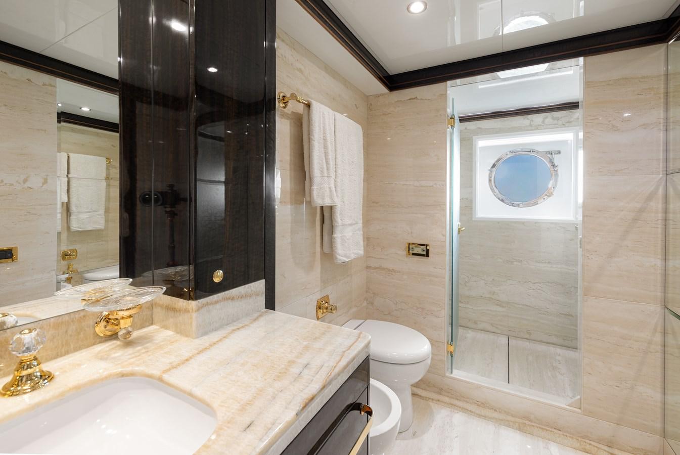 a bathroom with a large mirror aboard LADY TAHITI Yacht for Sale