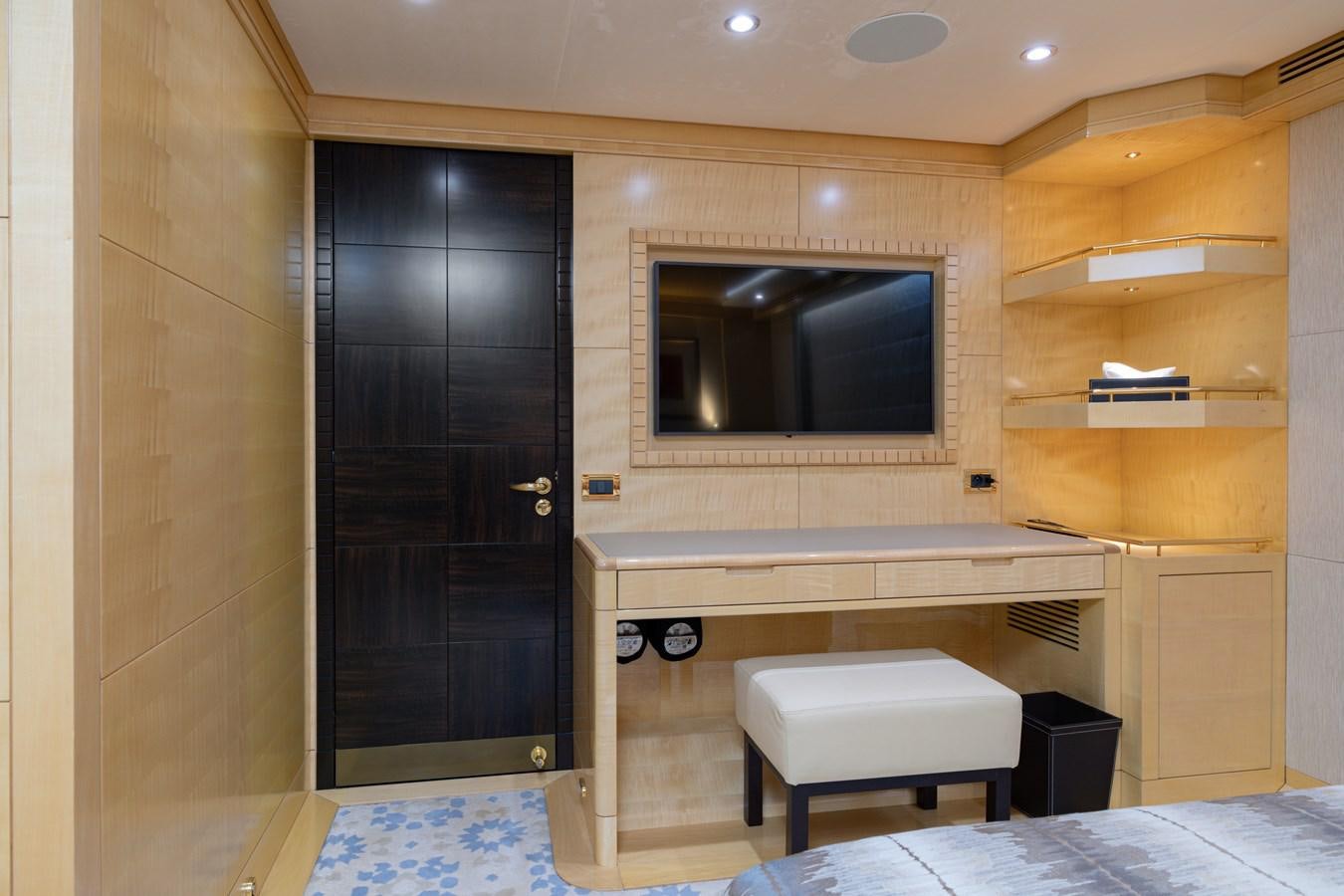 a room with a tv and a bed aboard LADY TAHITI Yacht for Sale