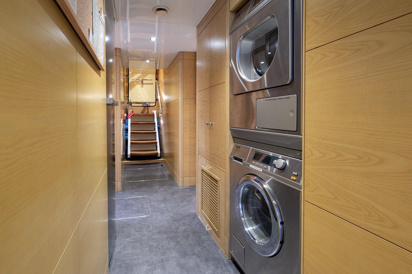 a room with a washer and dryer aboard LADY TAHITI Yacht for Sale