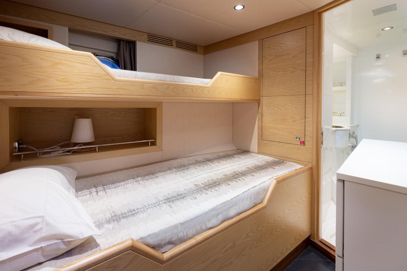 a bed in a room aboard LADY TAHITI Yacht for Sale