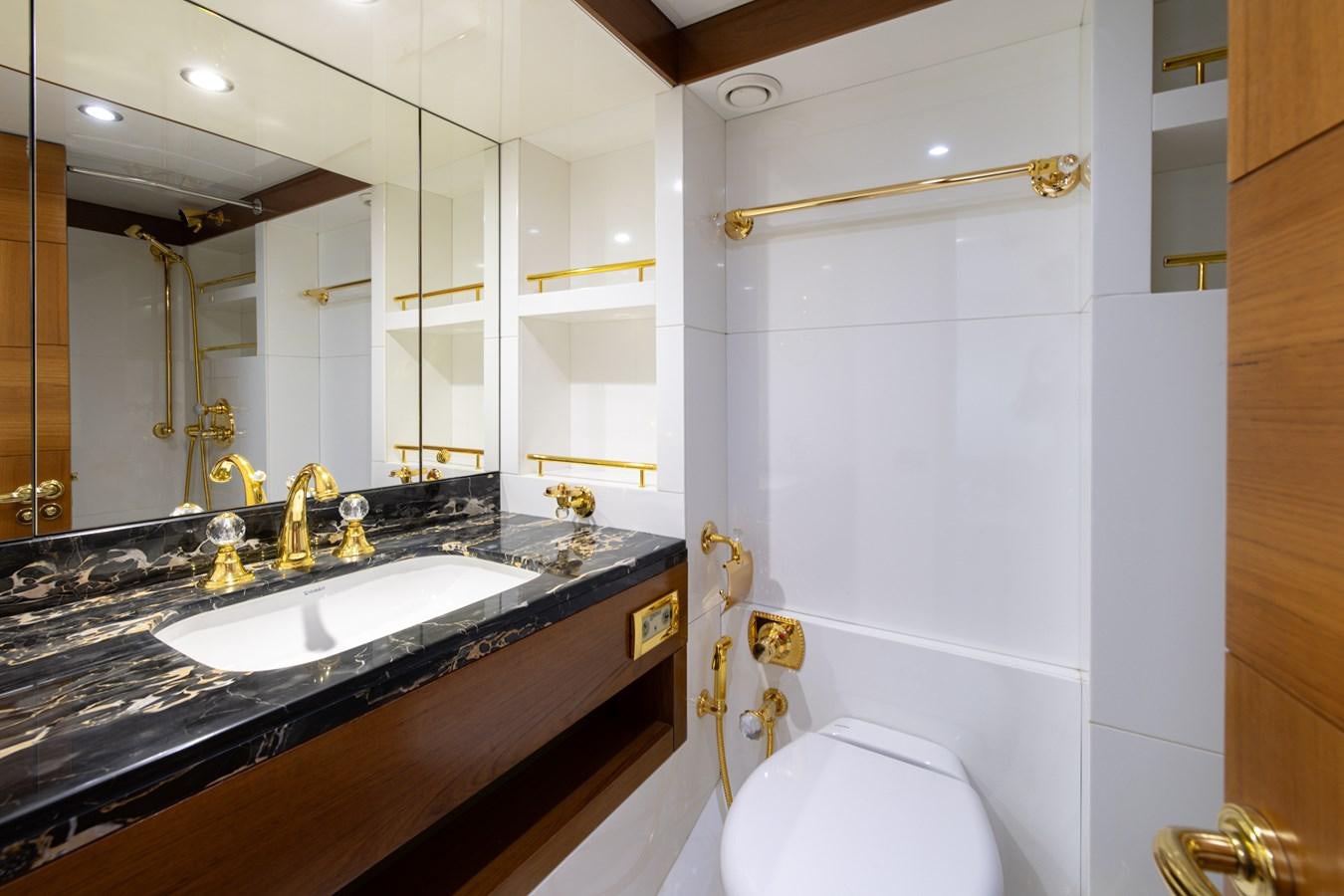 a bathroom with a sink and a mirror aboard LADY TAHITI Yacht for Sale