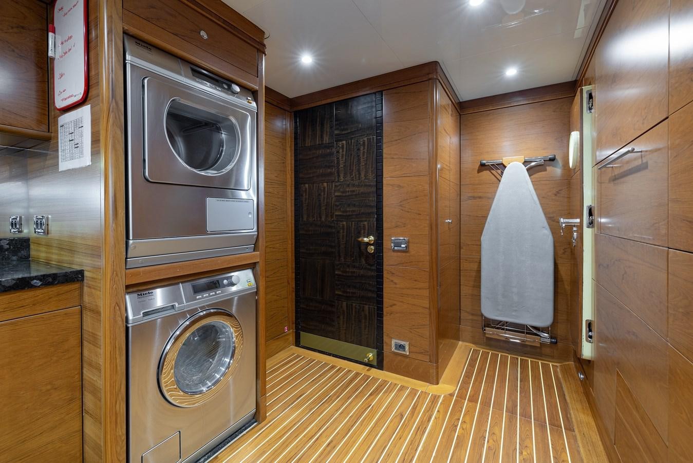 a kitchen with a washer and dryer aboard LADY TAHITI Yacht for Sale
