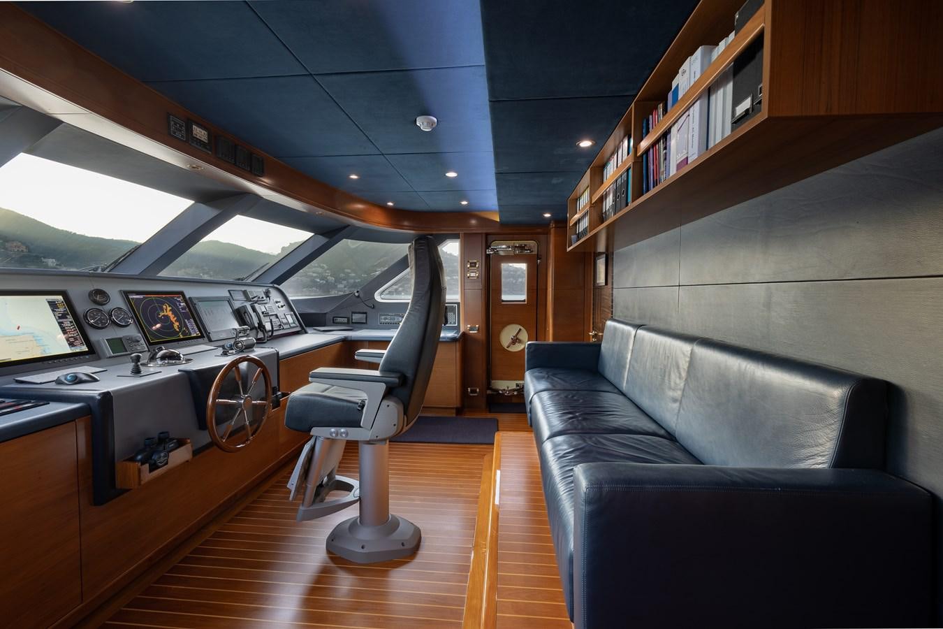 a room with a couch and a chair aboard LADY TAHITI Yacht for Sale