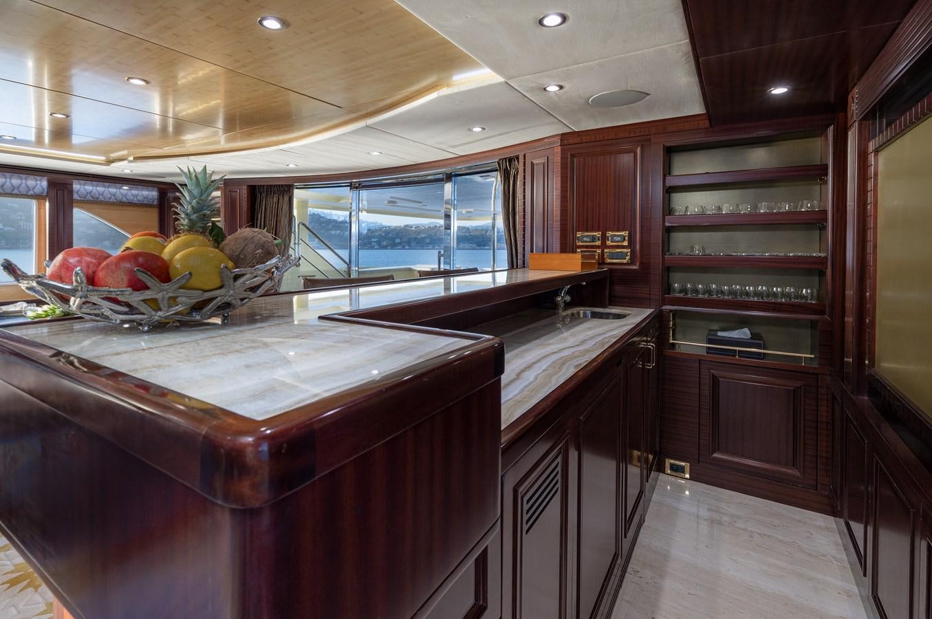 a kitchen with a large island aboard LADY TAHITI Yacht for Sale