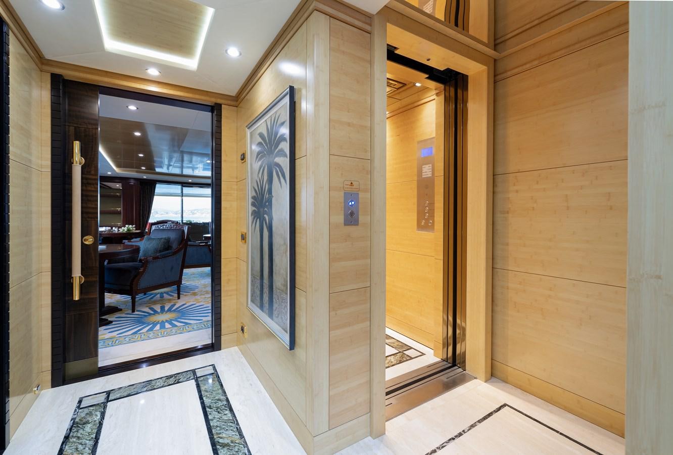 a hallway with a glass door aboard LADY TAHITI Yacht for Sale