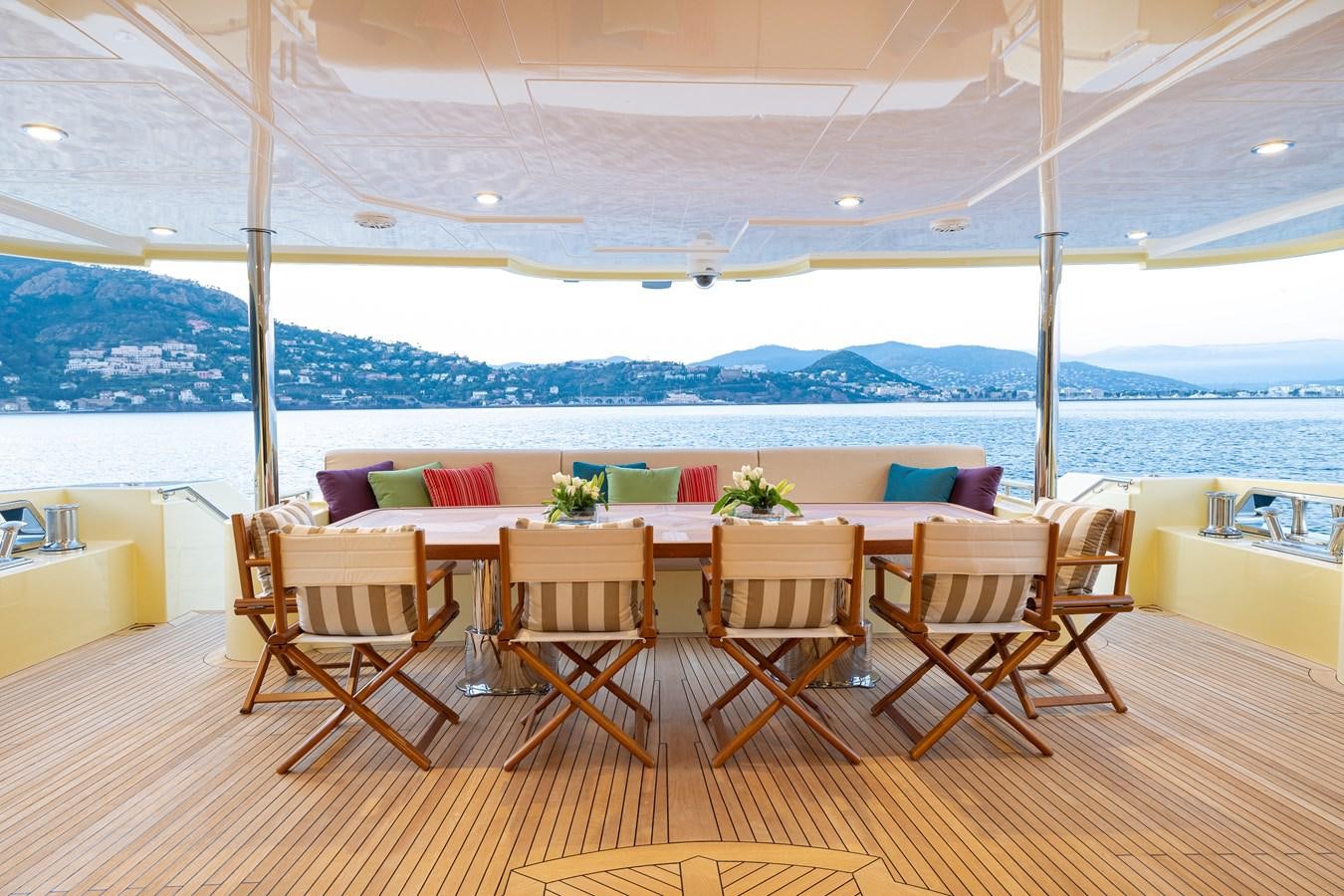 a table and chairs on a deck aboard LADY TAHITI Yacht for Sale