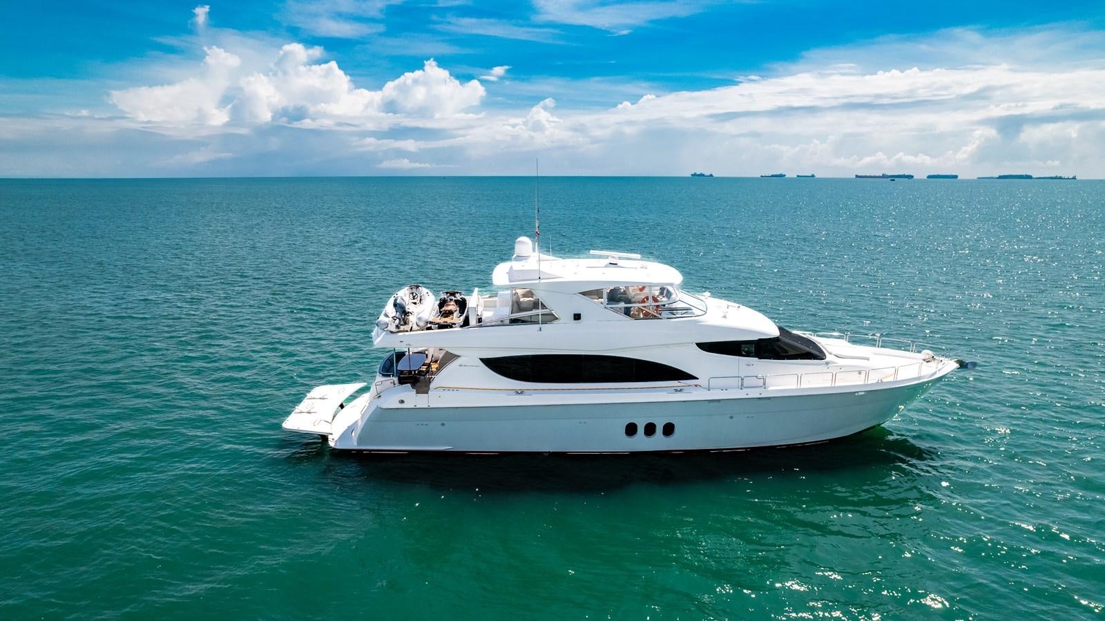 a white boat in the water aboard HATTERAS 105 Yacht for Sale