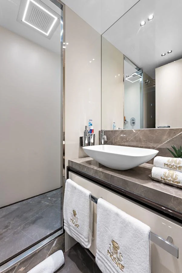 a bathroom with a sink and a mirror aboard MOSHE Yacht for Sale
