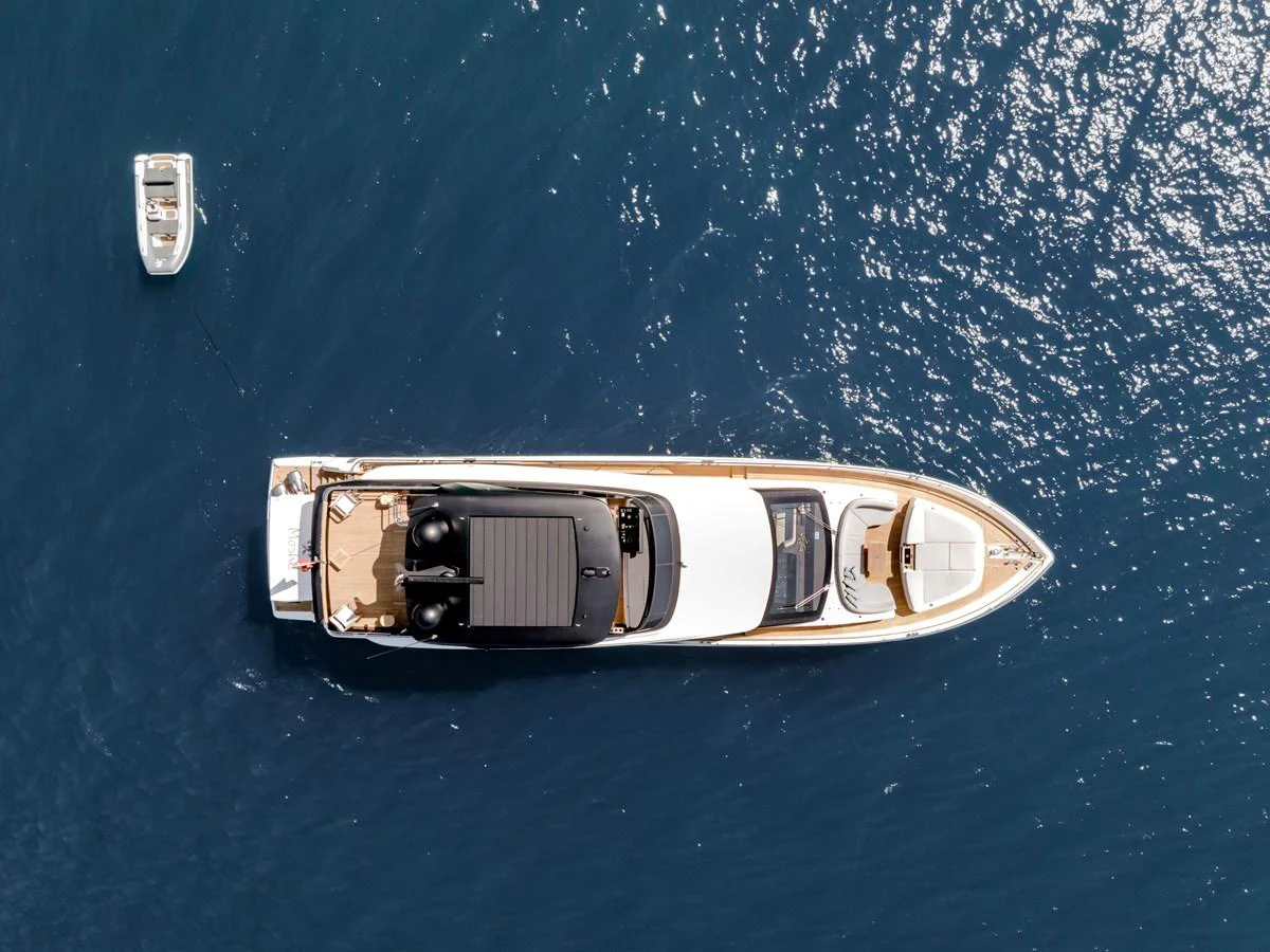 a gold and silver boat on water aboard MOSHE Yacht for Sale