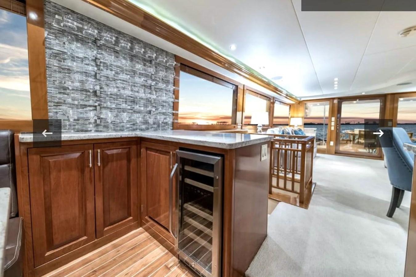 a kitchen with a large glass wall aboard VITA BREVIS Yacht for Sale