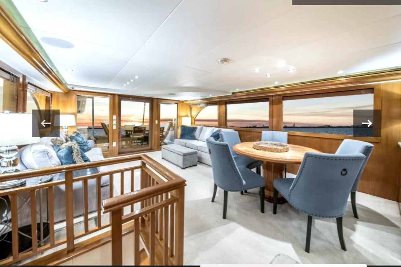 a room with a table and chairs aboard VITA BREVIS Yacht for Sale