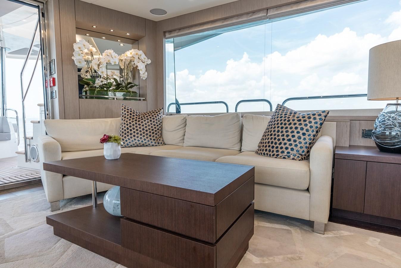 a living room with a large window aboard F5 Yacht for Sale