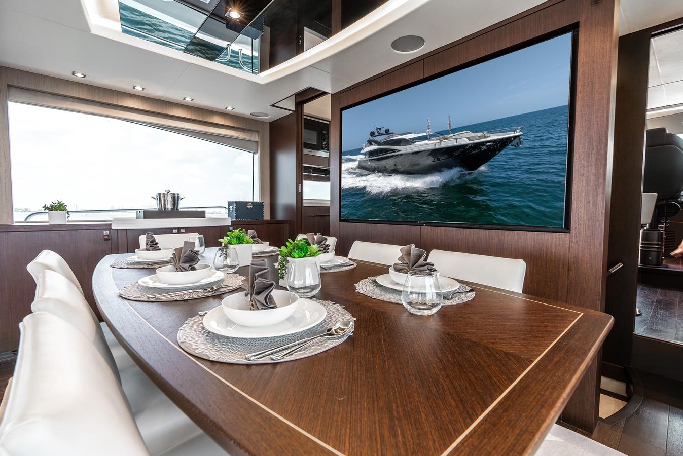 a table with plates and cups on it aboard F5 Yacht for Sale