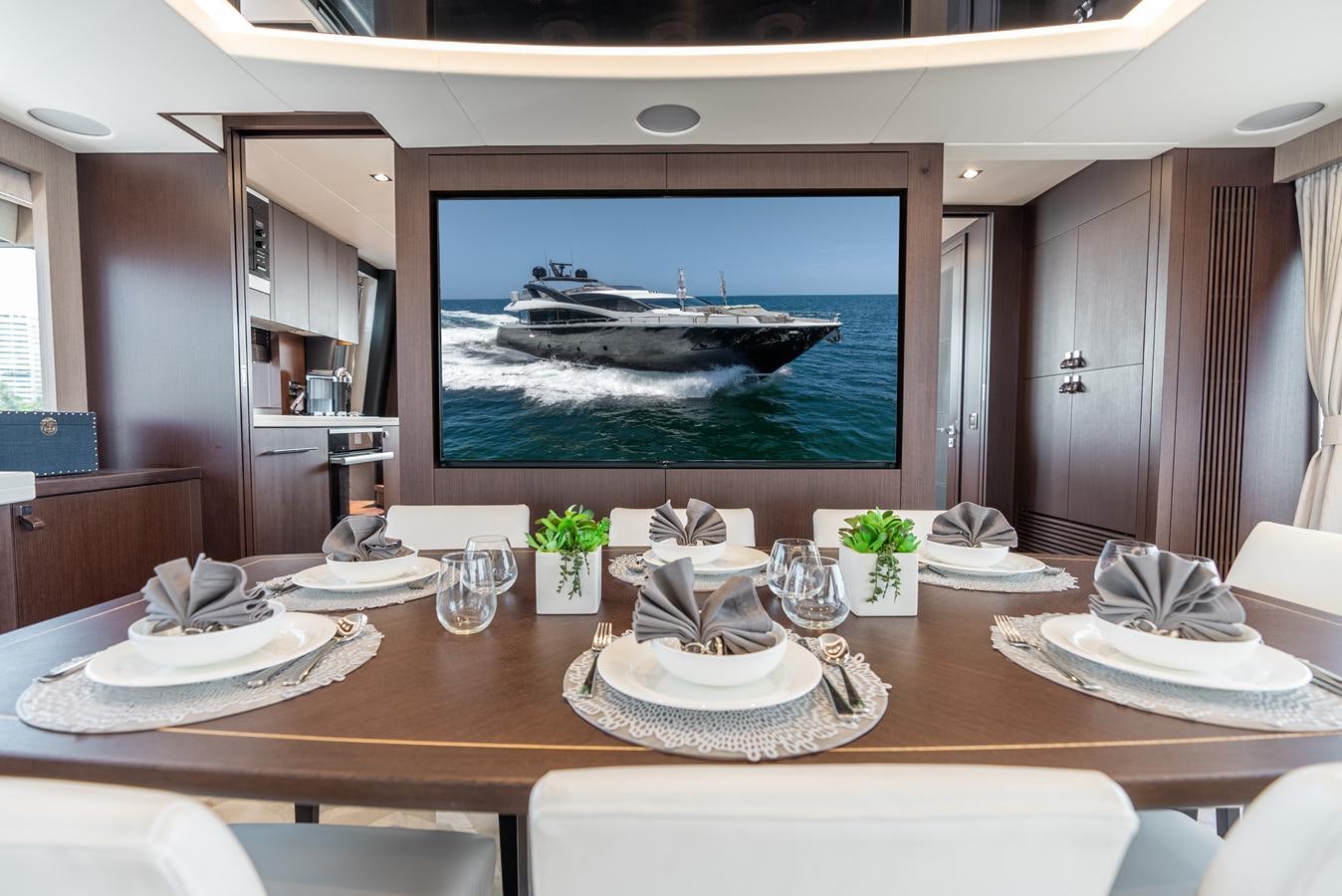 a table with plates and glasses aboard F5 Yacht for Sale