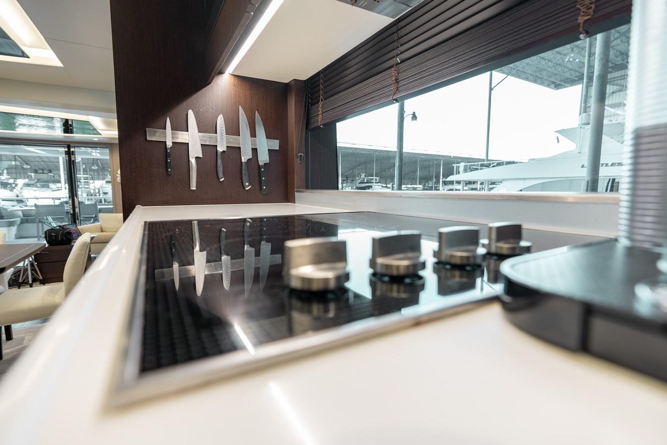 a large kitchen with a large island aboard F5 Yacht for Sale