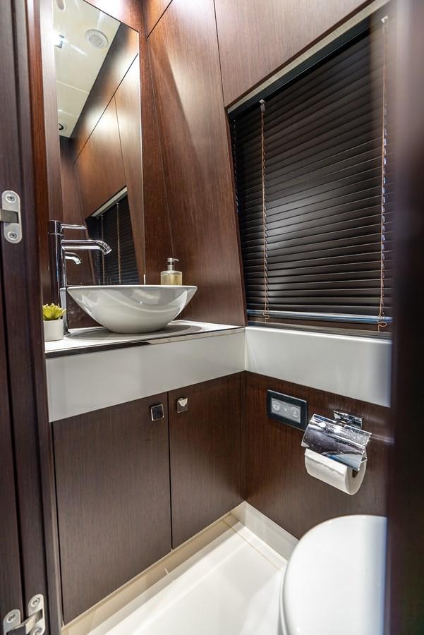 a bathroom with a sink and a mirror aboard F5 Yacht for Sale