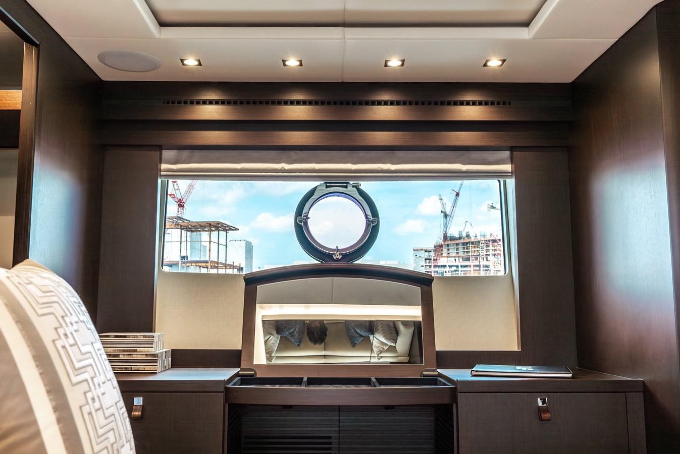 a view of a city through a window aboard F5 Yacht for Sale