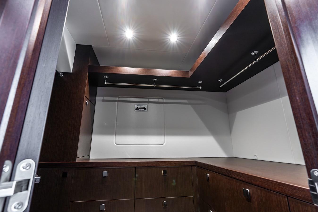a room with cabinets and a light aboard F5 Yacht for Sale