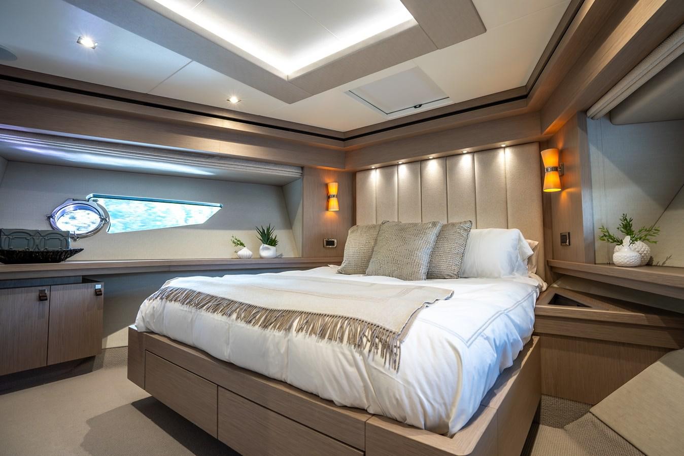 a room with a bed and a window aboard F5 Yacht for Sale