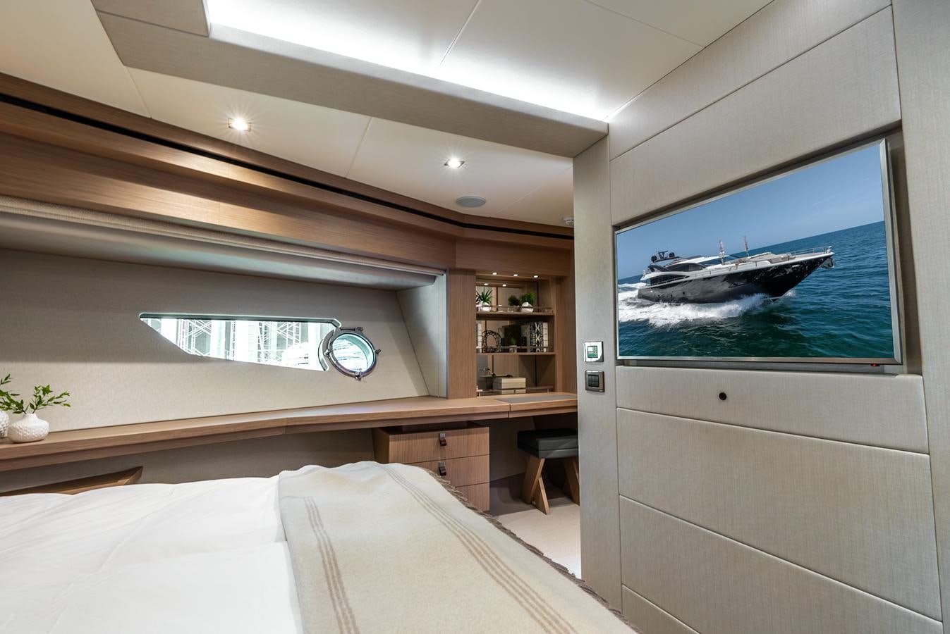 a room with a bed and a fish tank aboard F5 Yacht for Sale