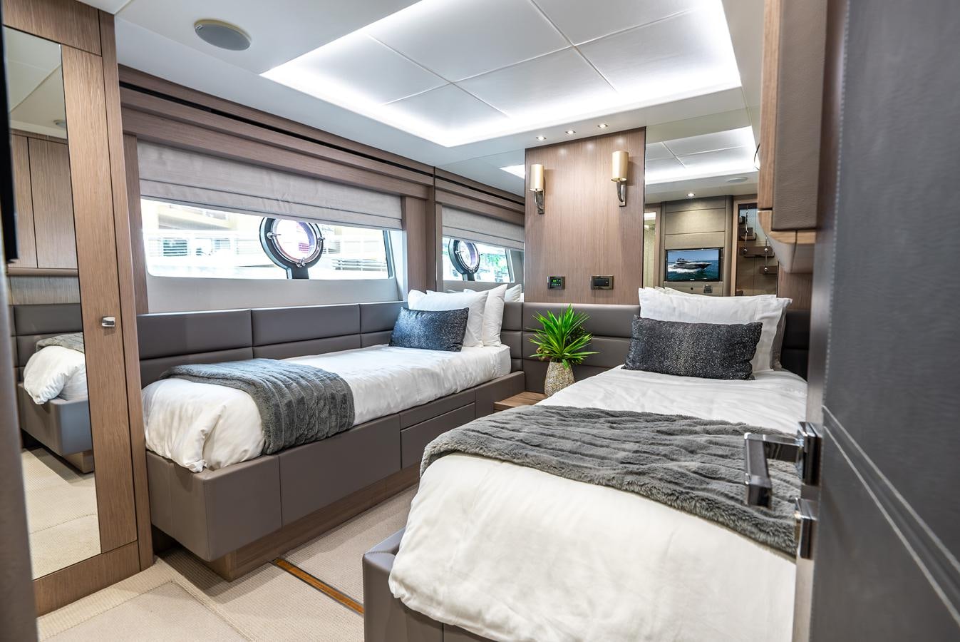 a room with two beds aboard F5 Yacht for Sale