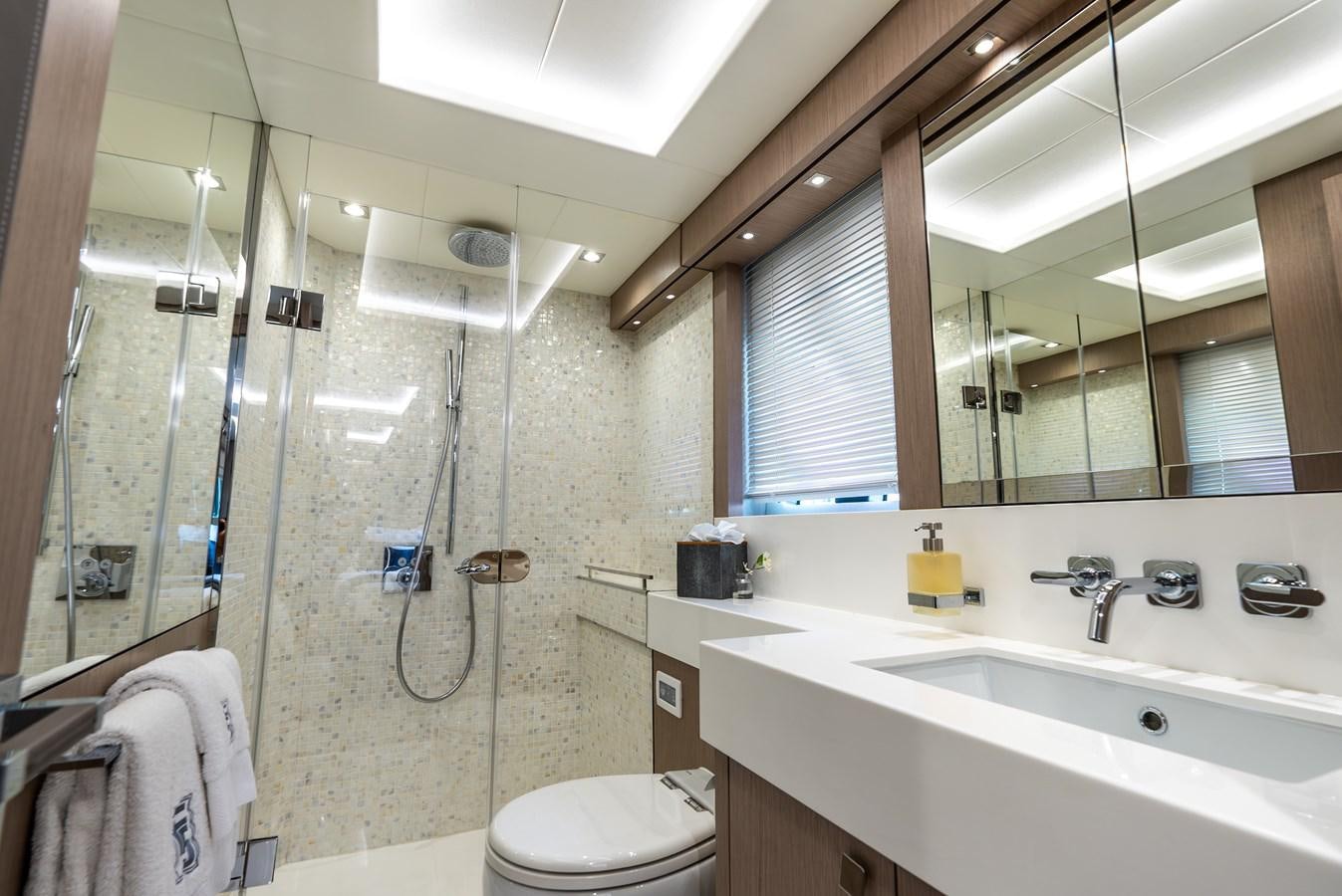 a bathroom with a shower and sink aboard F5 Yacht for Sale